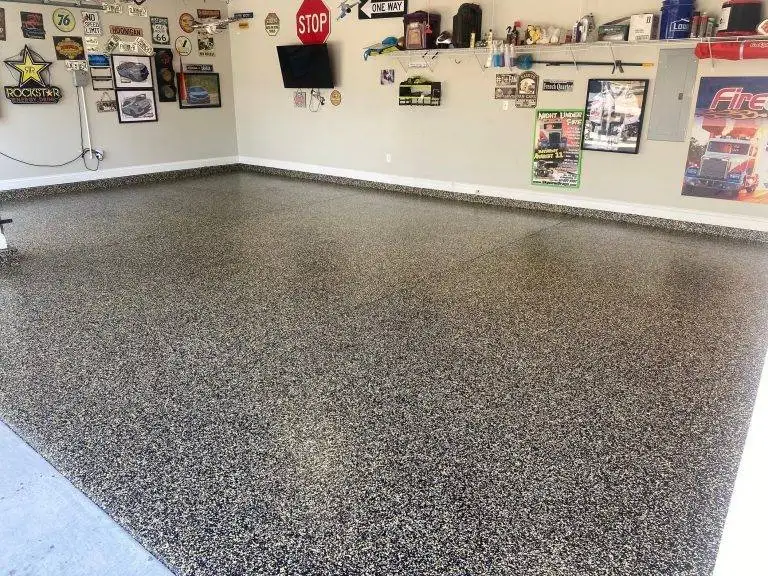 a garage floor with a epoxy concrete services finish